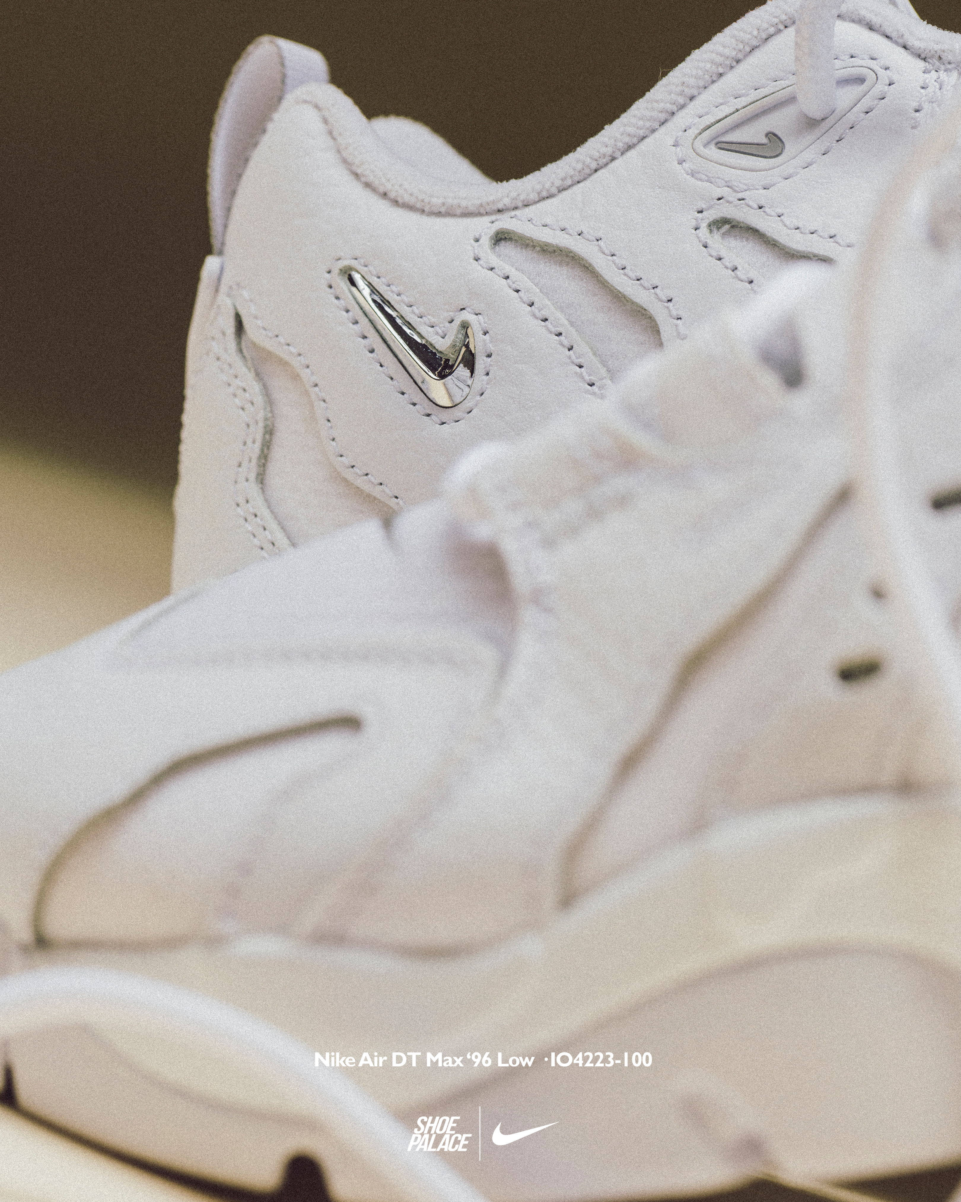 White sneakers with a sleek design and Nike logo.