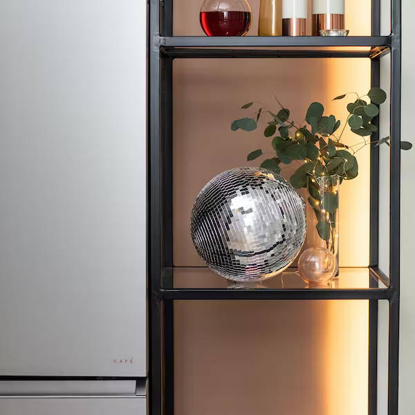 Disco ball on shelf by Modern Glass refrigerator