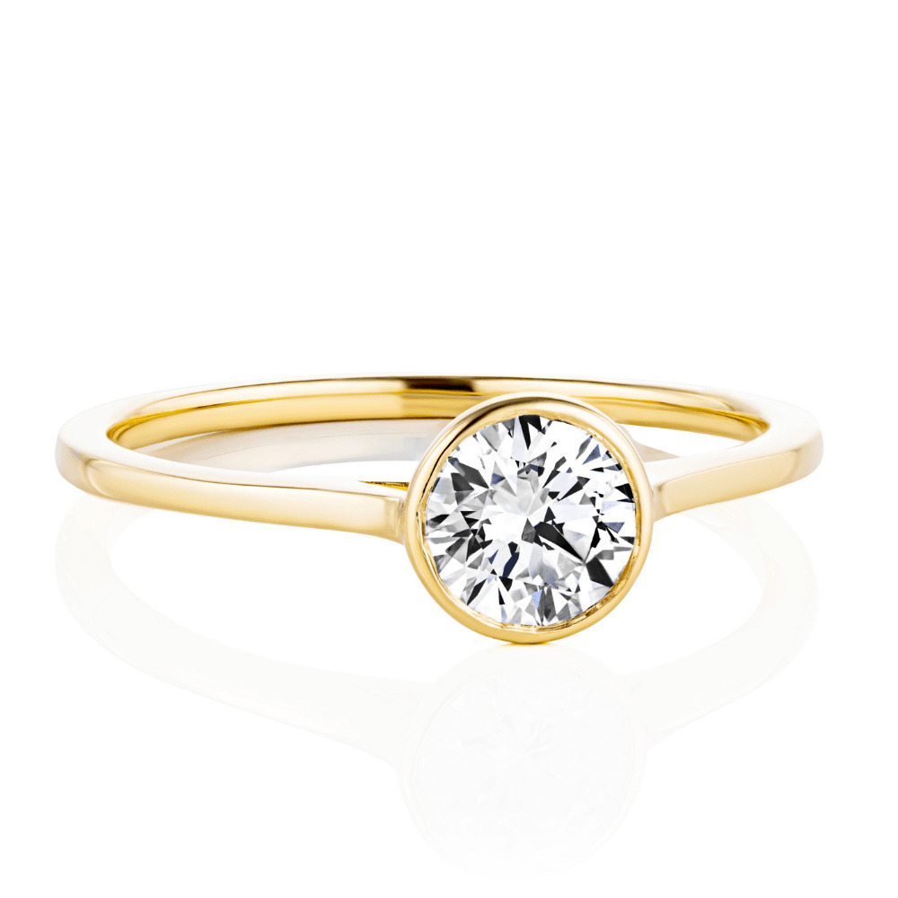 modern bezel set diamond stackable engagement ring in 14k yellow gold