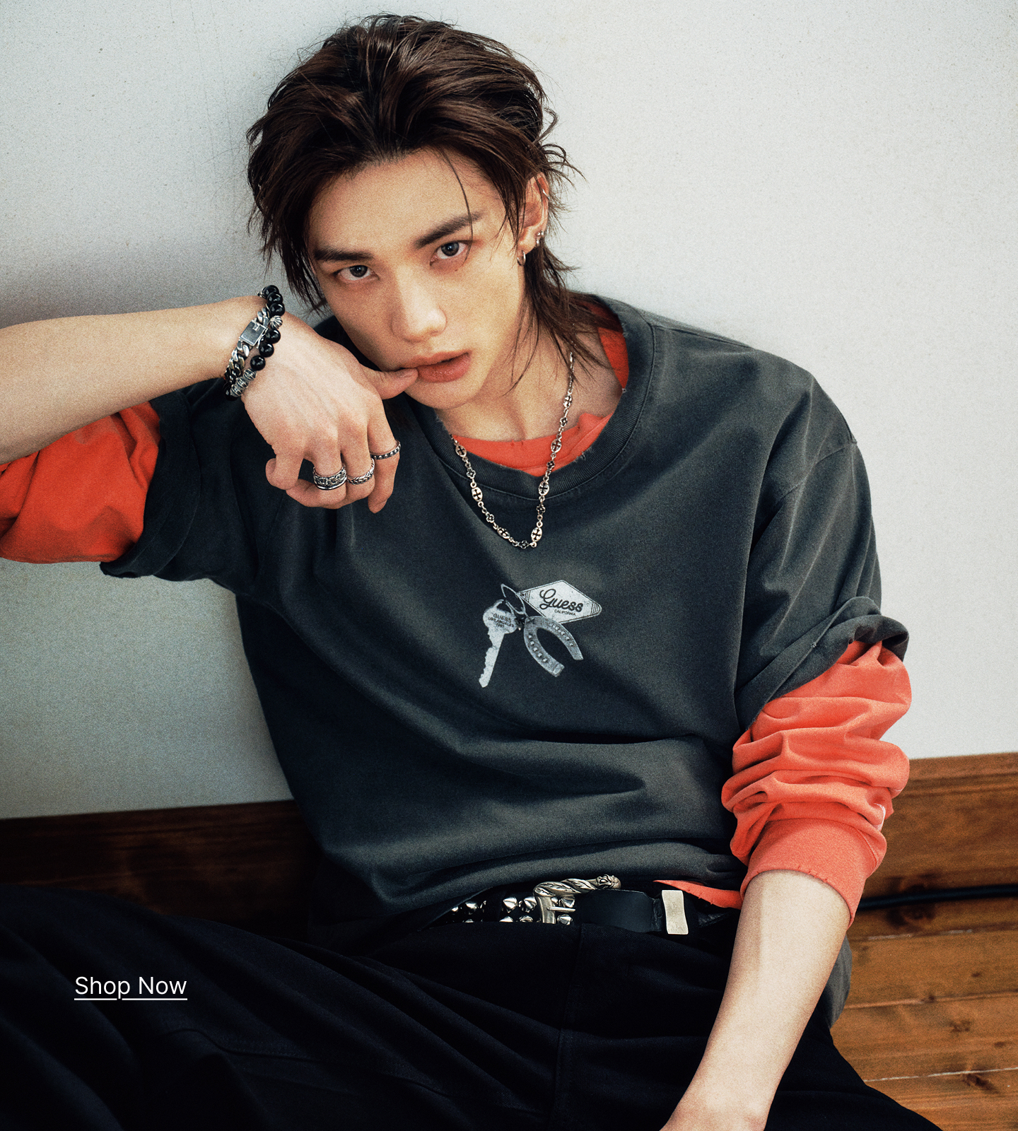 Hyunjin wearing GUESS x Hyunjin posing against a neutral background.