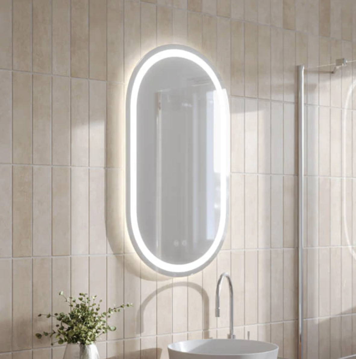 Pill shaped LED Mirror in a warm bathroom design