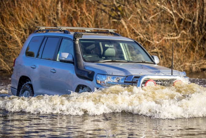 Photo of Toyota with a snorkel doing a water crossing.