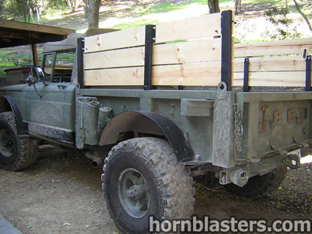 Rear three-quarter Scott's Jeep M715 military truck tailgate taillights pickup bed exterior gallery photo 3