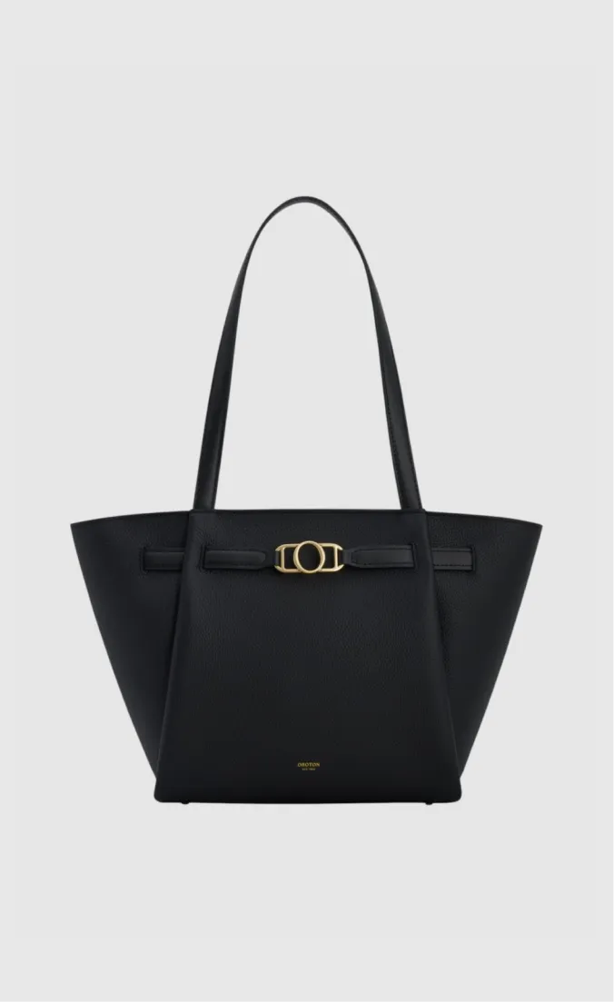 Black tote bag with a gold buckle and long handles.