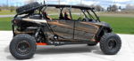 Side profile black orange KJmotorsports.com Polaris RZR four-seater roll cage spare tire beadlock wheels Conductor's Special 244 Nightmare Edition train horn kit featured customer install gallery photo 1
