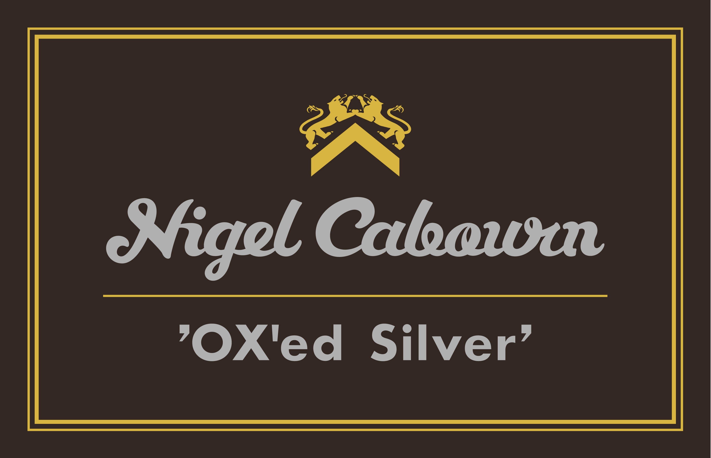Nigel Cabourn 'OX'ed Silver' logo on a dark background.
