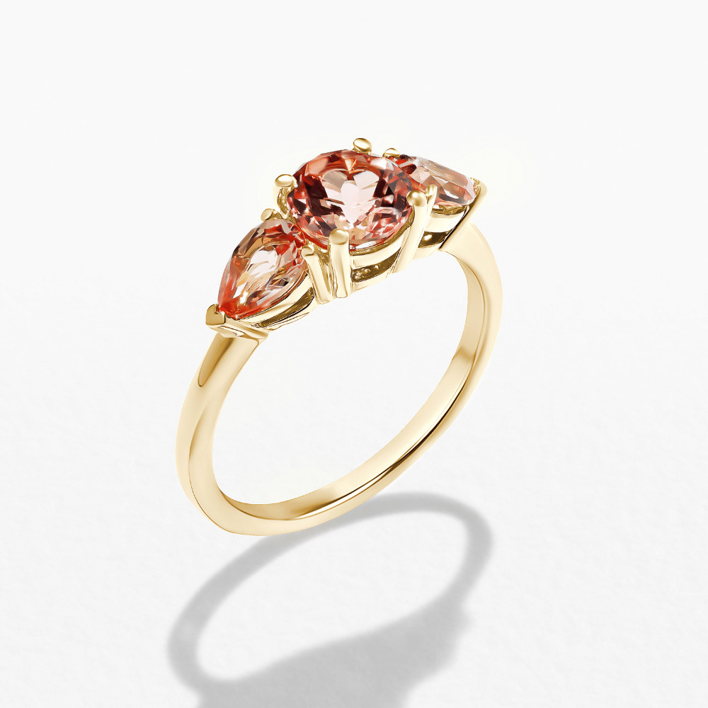 Unique three stone engagement ring with pink sapphire stones in 14k yellow gold setting