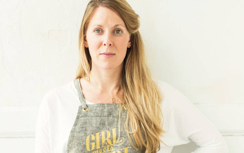 Portrait of Audra Lawlor, Founder of Girl Meets Dirt, wearing a linen apron. 