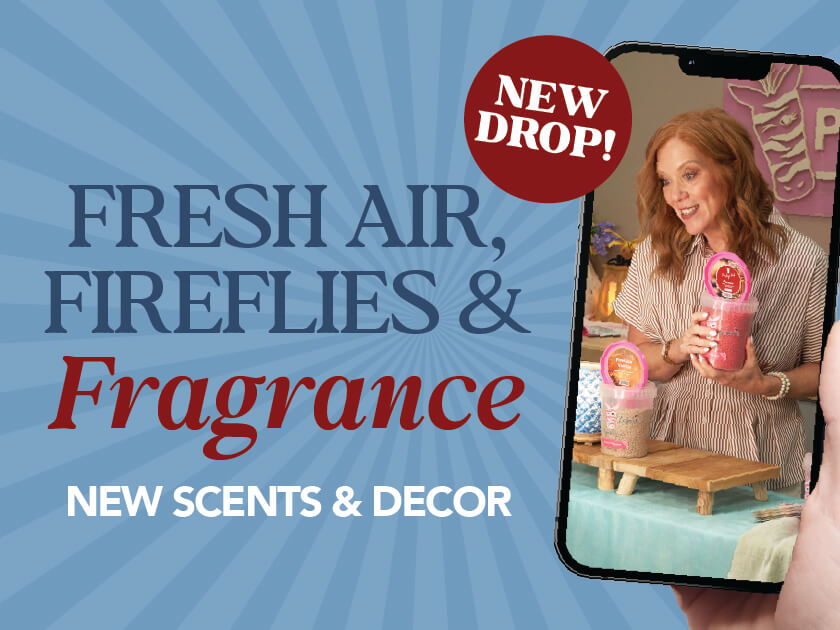 Image promoting new scents and decor featuring a woman holding a phone.