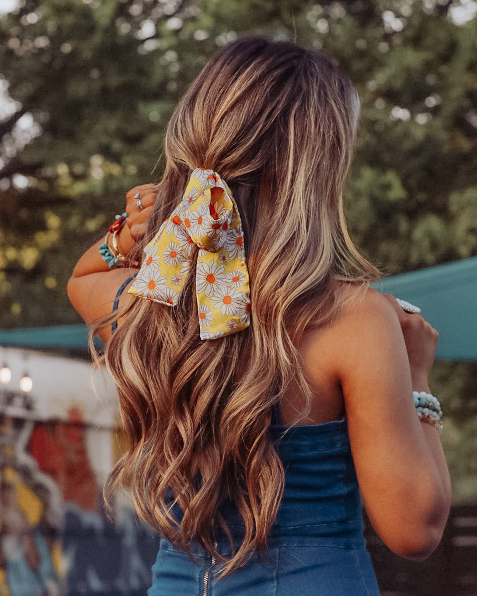 Image of Beach waved hair with floral ribbon in hair. 