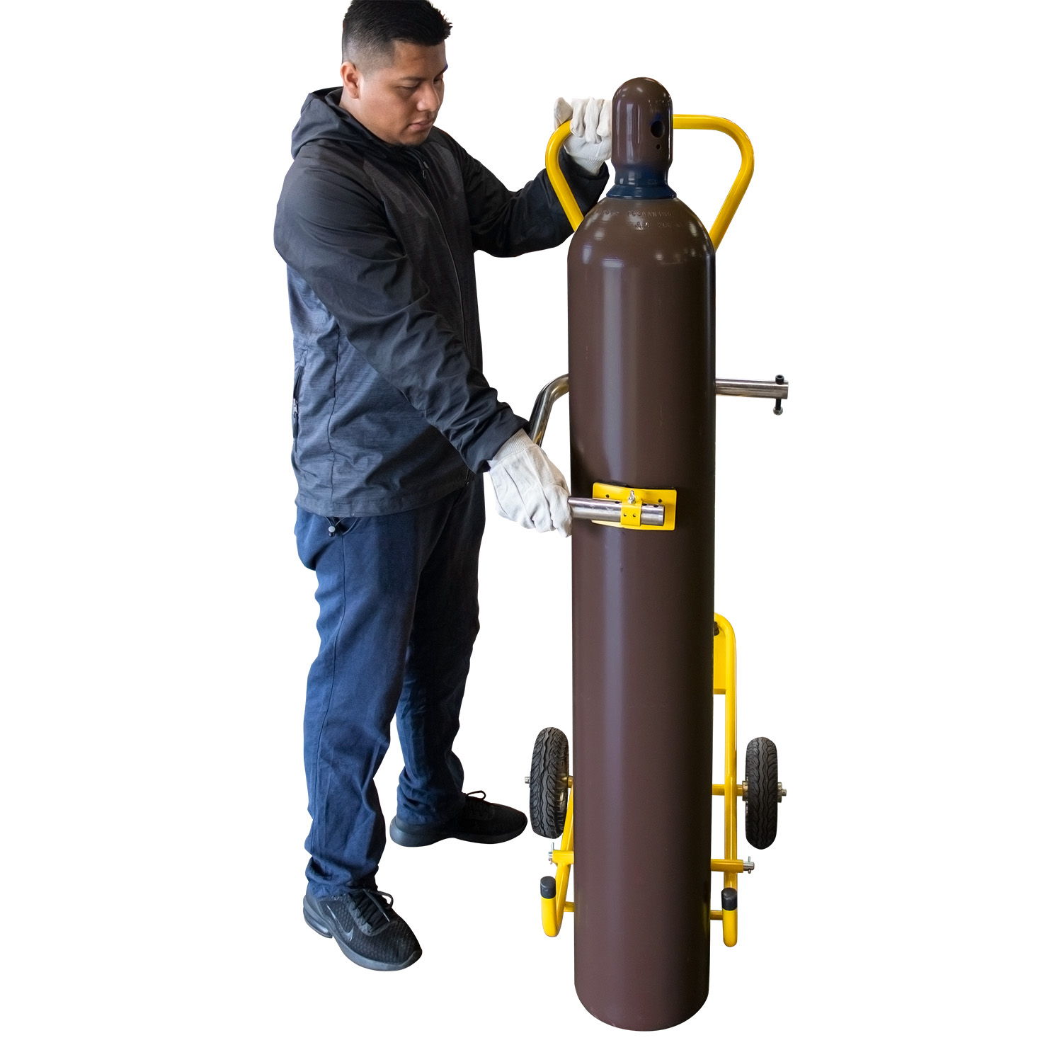 Person adjusting a large gas cylinder on a cart.