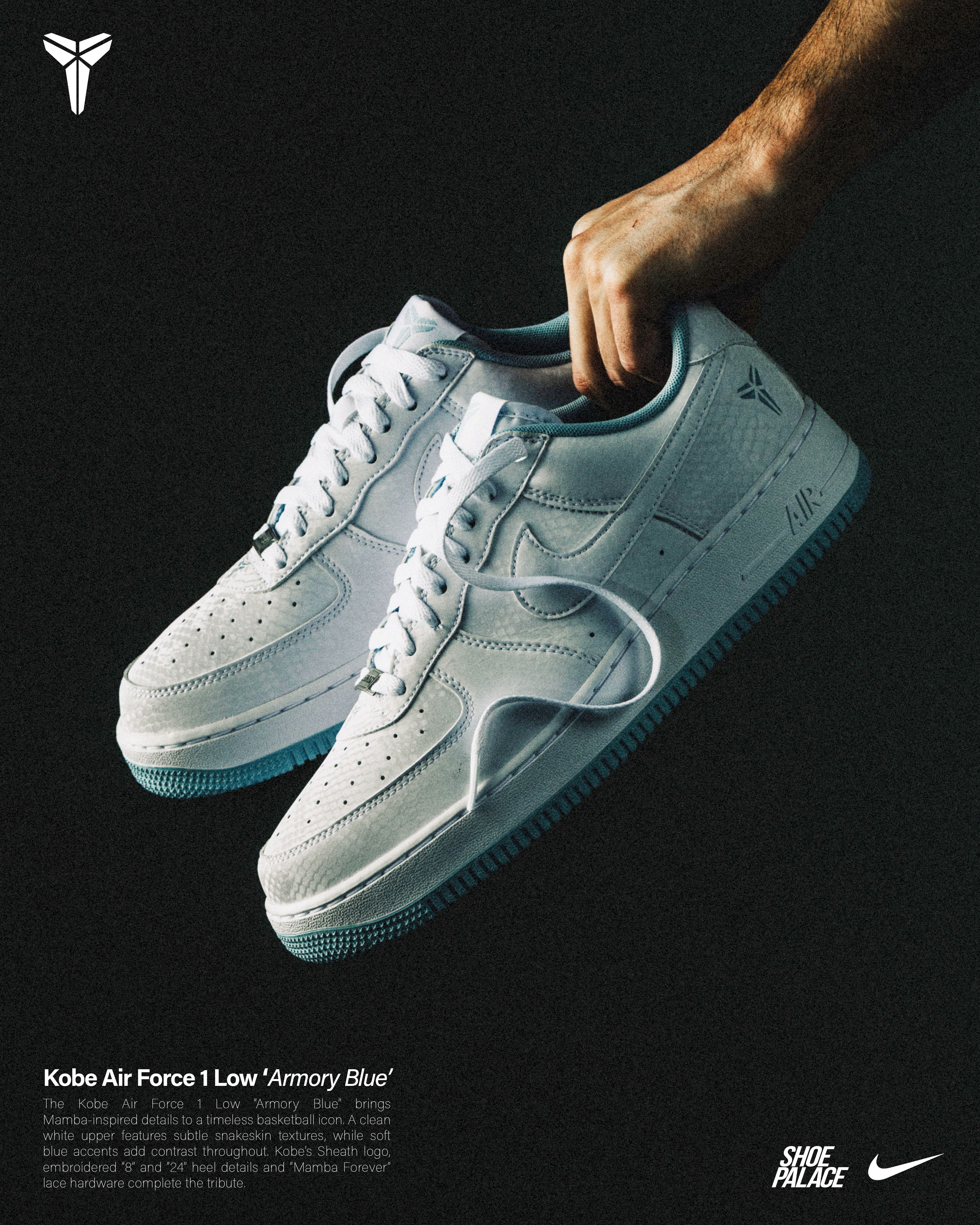 A hand holding a pair of Nike Kobe Air Force 1 sneakers.