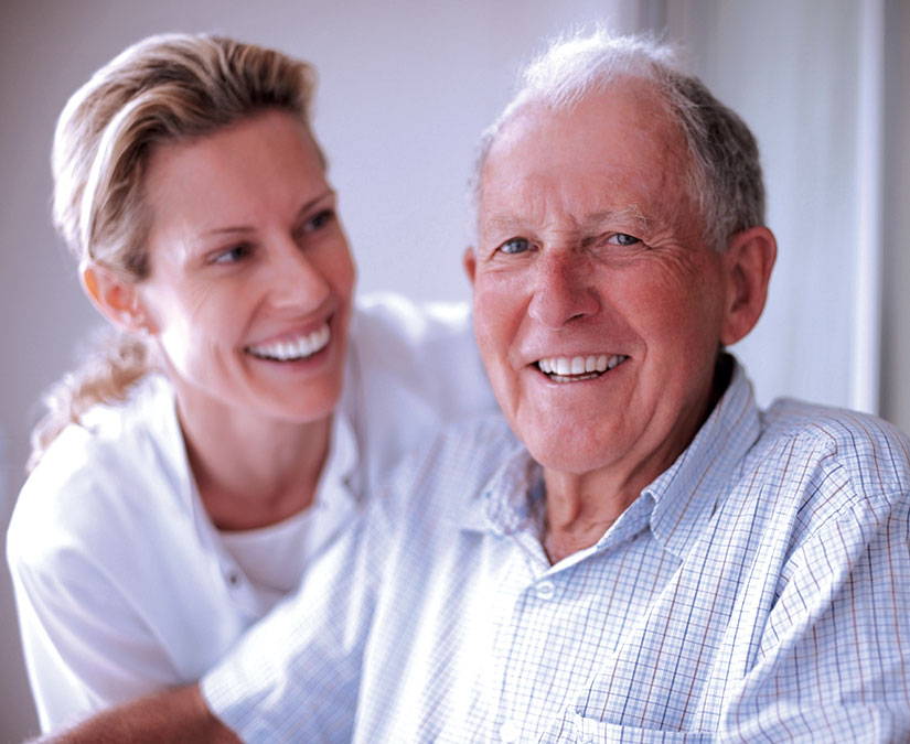 Caregiver with a man who has Aphasia 