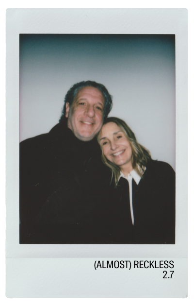Two smiling people posing together for a photo.