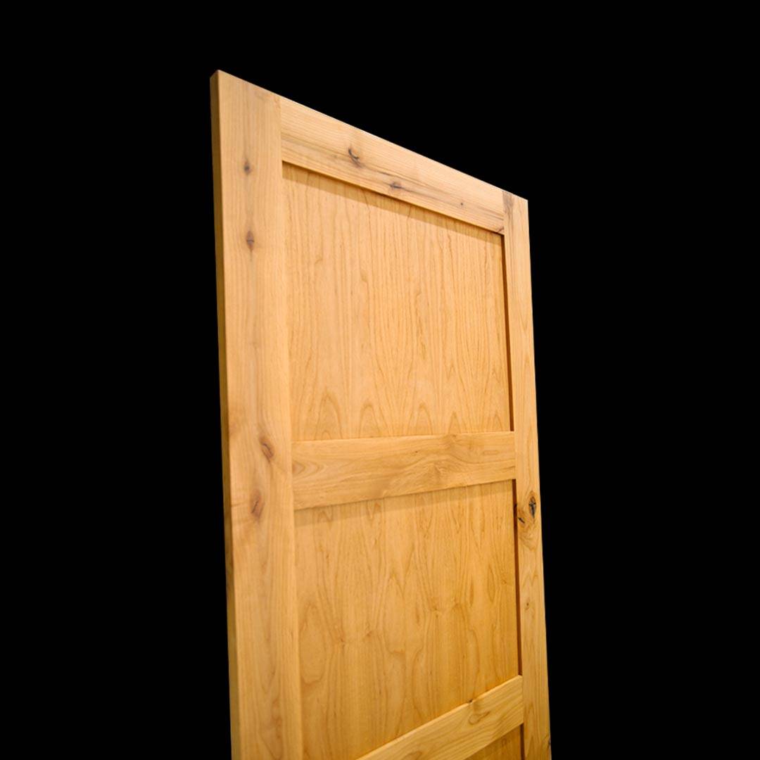 Shaker Three Panel Barn Door Design by RealCraft on a solid black background