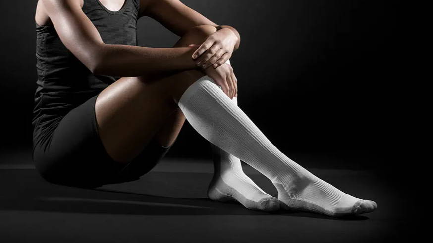 Female athlete wearing TheraSport Athletic Compression Socks