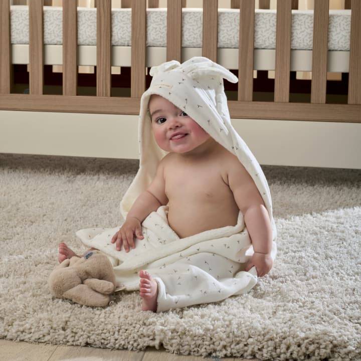 Baby wearing a towel