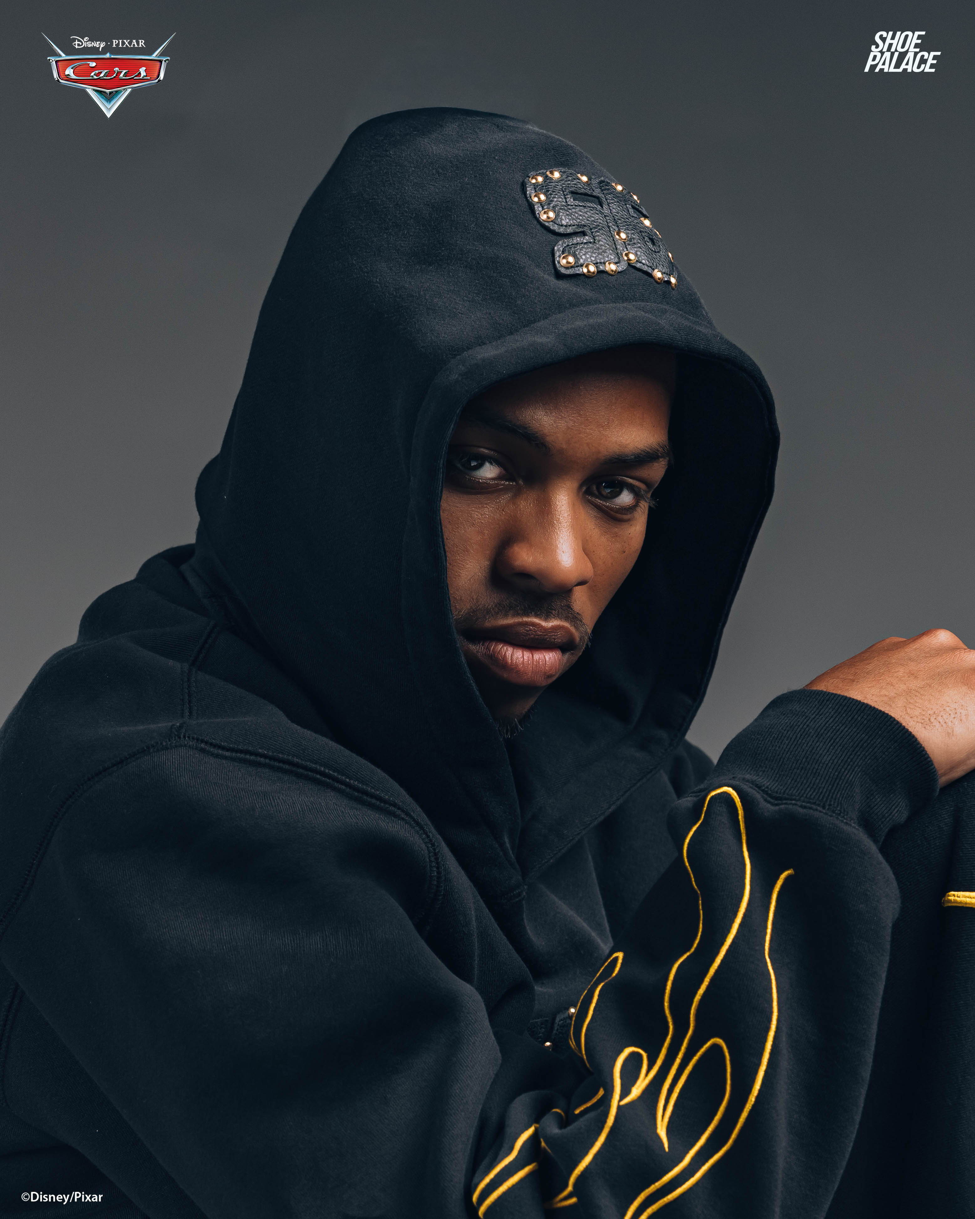 Young man in a hoodie, looking directly at the camera.