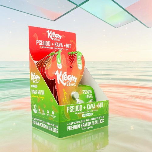Colorful packaging for Kava products displayed against a reflective background.