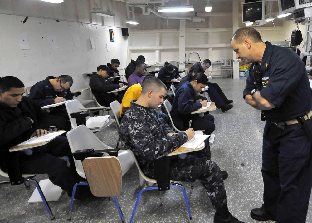 Sailors aboard the multipurpose amphibious assault ship USS Bataan attend an Armed Services Vocational Battery preparation course. The three-week course, taught by volunteer service members, is designed to improve ASVAB scores to maximize rating conversion options in the Perform-to-Serve program. Bataan is deploying to the Mediterranean Sea. (U.S. Navy photo by Seaman Tamekia Perdue)