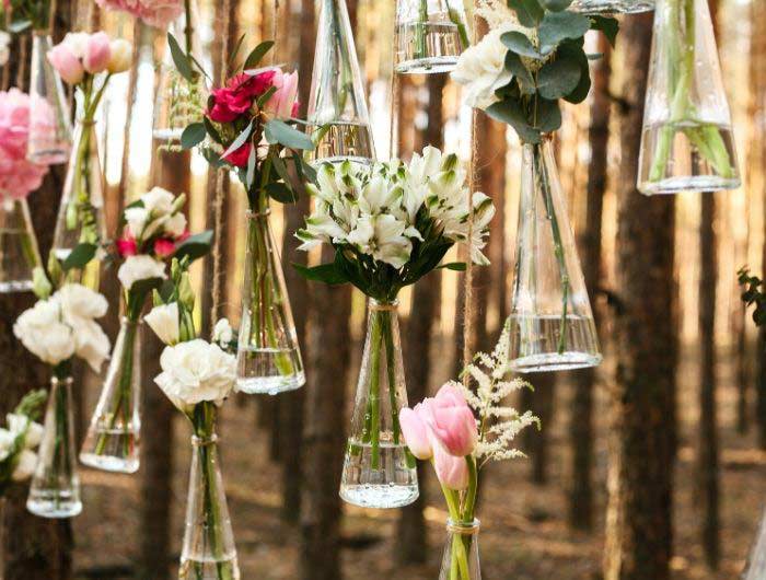 Wedding reception flowers hanging in vases