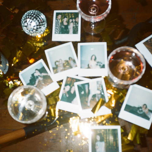 polaroid pictures of friends at a new years eve celebration