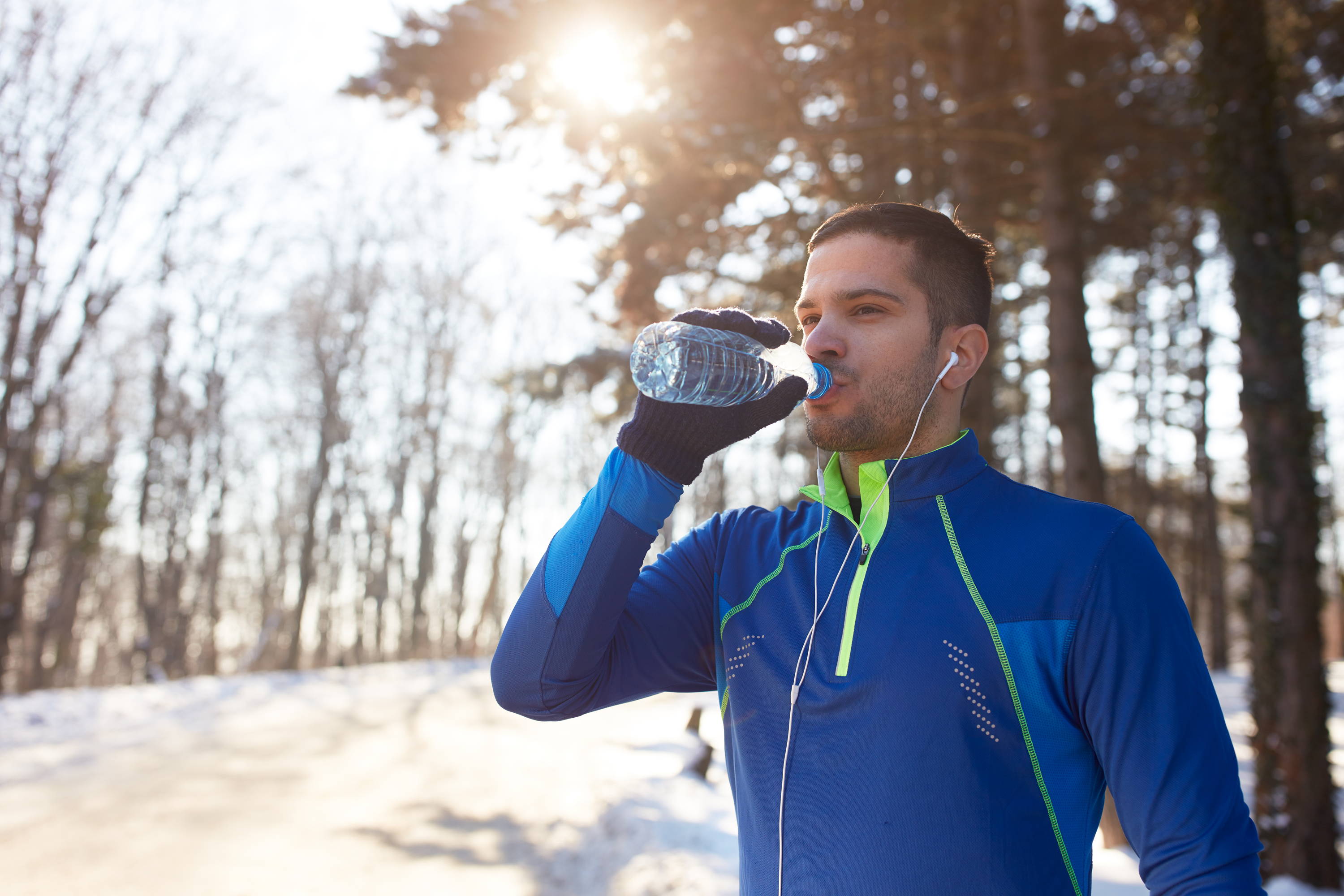 Athlete Drinking Water In Winter