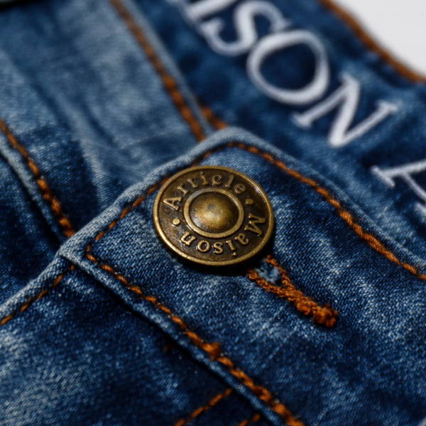 close up of maison article jeans button