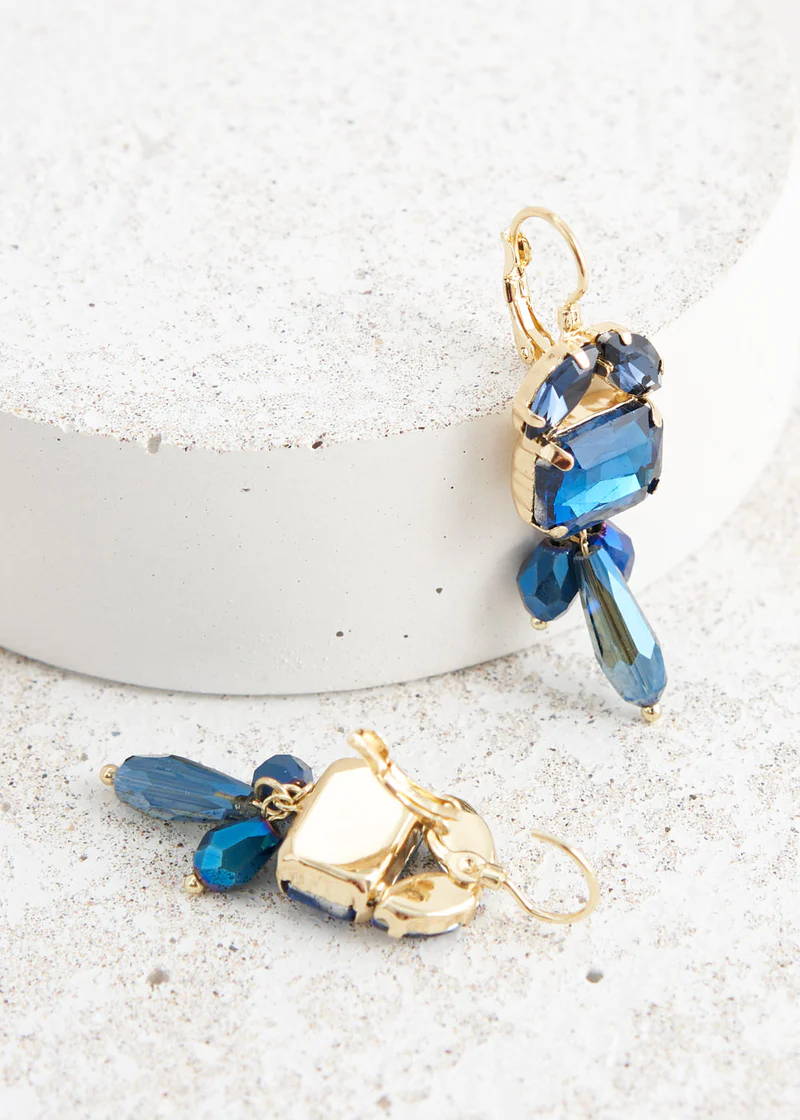 A pair of blue and gold dangly crystal earrings