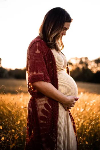 Pregnant woman praying for her unborn baby